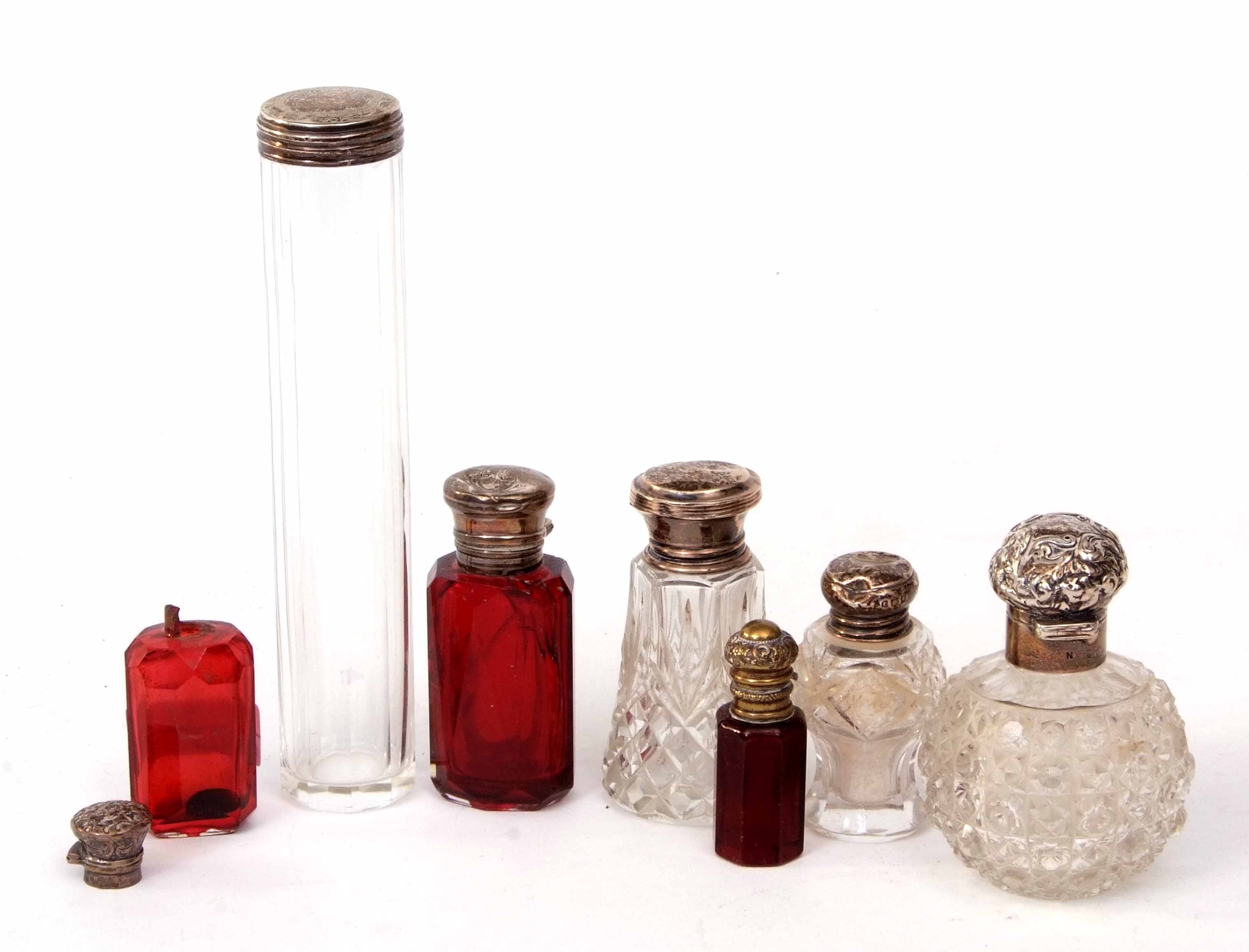 Mixed Lot: six various silver lidded toiletry bottles including two ruby glass scent bottles (both