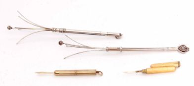 Mixed Lot: comprising a 9ct gold cased retractable toothpick, the cylindrical case with engine