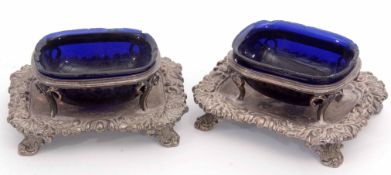 Two 19th century silver on copper open salts, each fitted with a shaped cobalt blue glass liner (