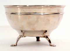 Early 20th century electro-plated bowl of polished circular form raised on three cast and applied