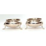 Two Victorian cauldron salts, each of polished form with beaded rims on three cast and applied feet,