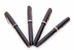 Mixed Lot: comprising four various black and gilt highlighted fountain pens, Parker "Duofold", all