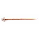 Antique yellow metal and seed pearl stick pin, the finial a cluster of 3 small seed pearls, 55mm