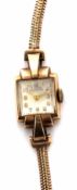 9ct gold ladies wrist watch and bracelet, the jewelled movement to the silvered square dial with