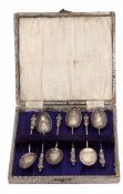 Cased set of Edward VII figural coffee spoons, each with cast and applied finials, twisted stems and