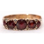 Victorian garnet and seed pearl ring, the five graduated circular cut garnets interspersed with