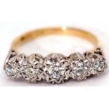 Precious metal five stone diamond ring, featuring five graduated diamonds, all in star engraved