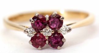 18ct ruby and diamond cluster ring featuring three small diamonds between four circular cut