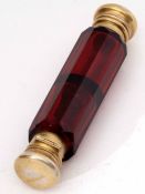 Late 19th century ruby glass and gilt metal mounted double ended scent bottle of faceted cylindrical