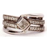 Precious metal and diamond cluster ring, the centre features four small princes cut diamonds,