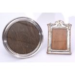 Mixed Lot: comprising a George V silver mounted easel backed photograph frame, the concave