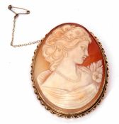 Large oval shaped carved cameo brooch depicting a classical lady, 65 x 50mm, framed in a 9ct gold