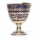 Unmarked white metal table sugar basket in the form of a footed pail with hinged handle, pierced and