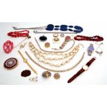 Cardboard box of costume jewellery to include various necklaces, brooches, wrist watches