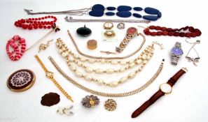 Cardboard box of costume jewellery to include various necklaces, brooches, wrist watches