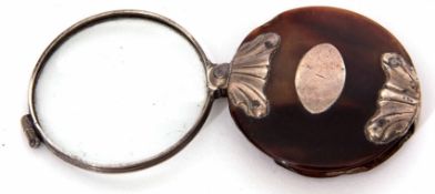 Early 19th century white metal mounted tortoiseshell folding magnifier of circular form with