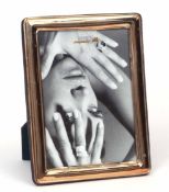 20th century white metal mounted easel backed photograph frame of plain and polished rectangular