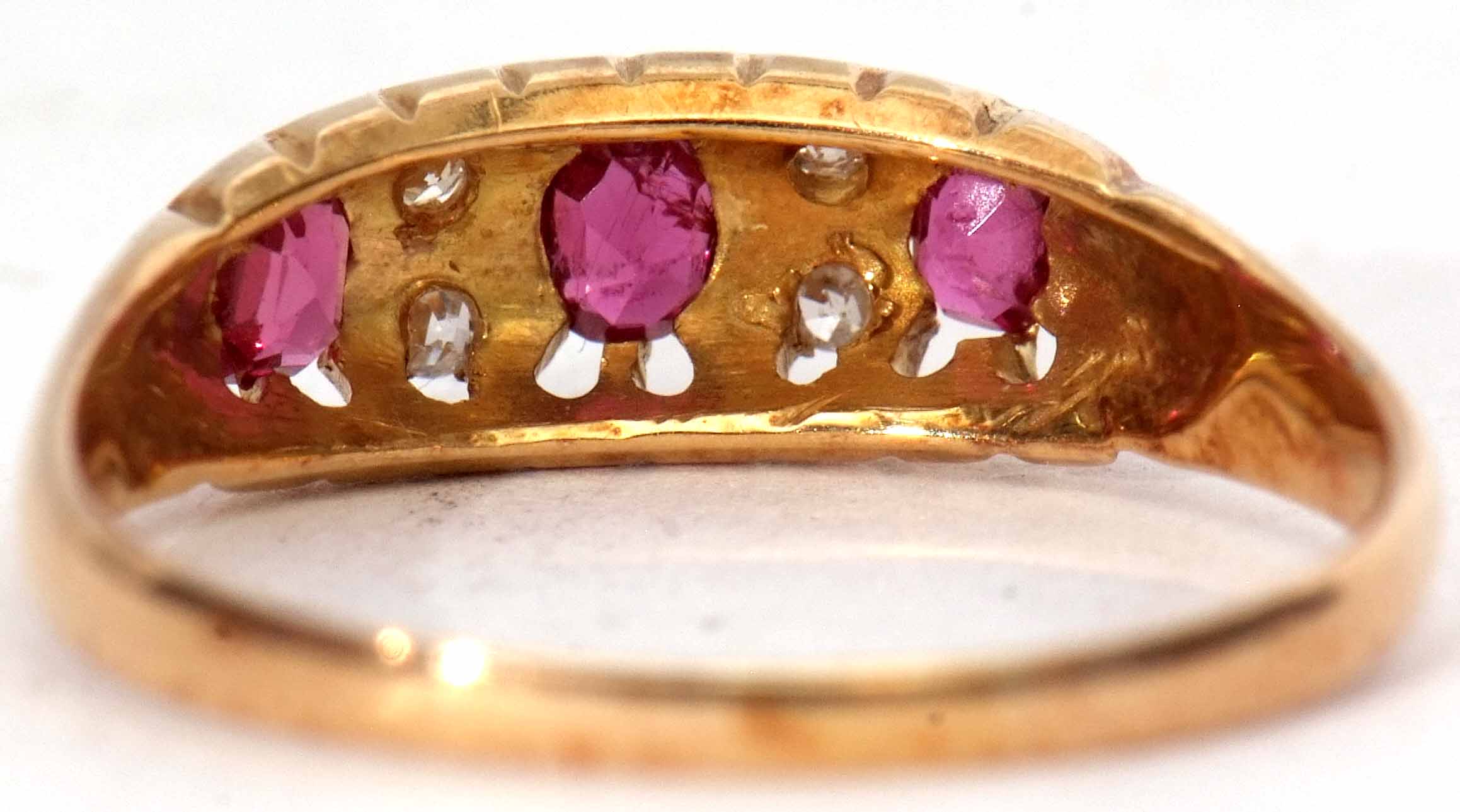 18ct gold ruby and diamond ring featuring 3 oval shaped rubies interspersed with 4 small diamonds, - Image 3 of 5