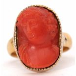 Antique carved coral ring, depicting a classical figure in a yellow metal frame to a 22ct gold