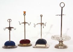 Mixed Lot: comprising four various hat pin stands comprising one with stepped circular base to a