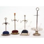 Mixed Lot: comprising four various hat pin stands comprising one with stepped circular base to a