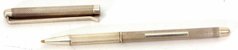 Elizabeth II silver cased ballpoint pen, the cylindrical case with pull off cover and all over