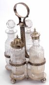 Late Victorian electro-plated four bottle cruet stand, the quatrefoil base raised on four ball