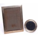 Mixed Lot: two various silver mounted easel backed photograph frames, the first of plain polished