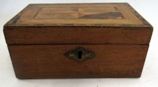 Small wooden box with marquetry inlay of a geometric design to top, 17cm long