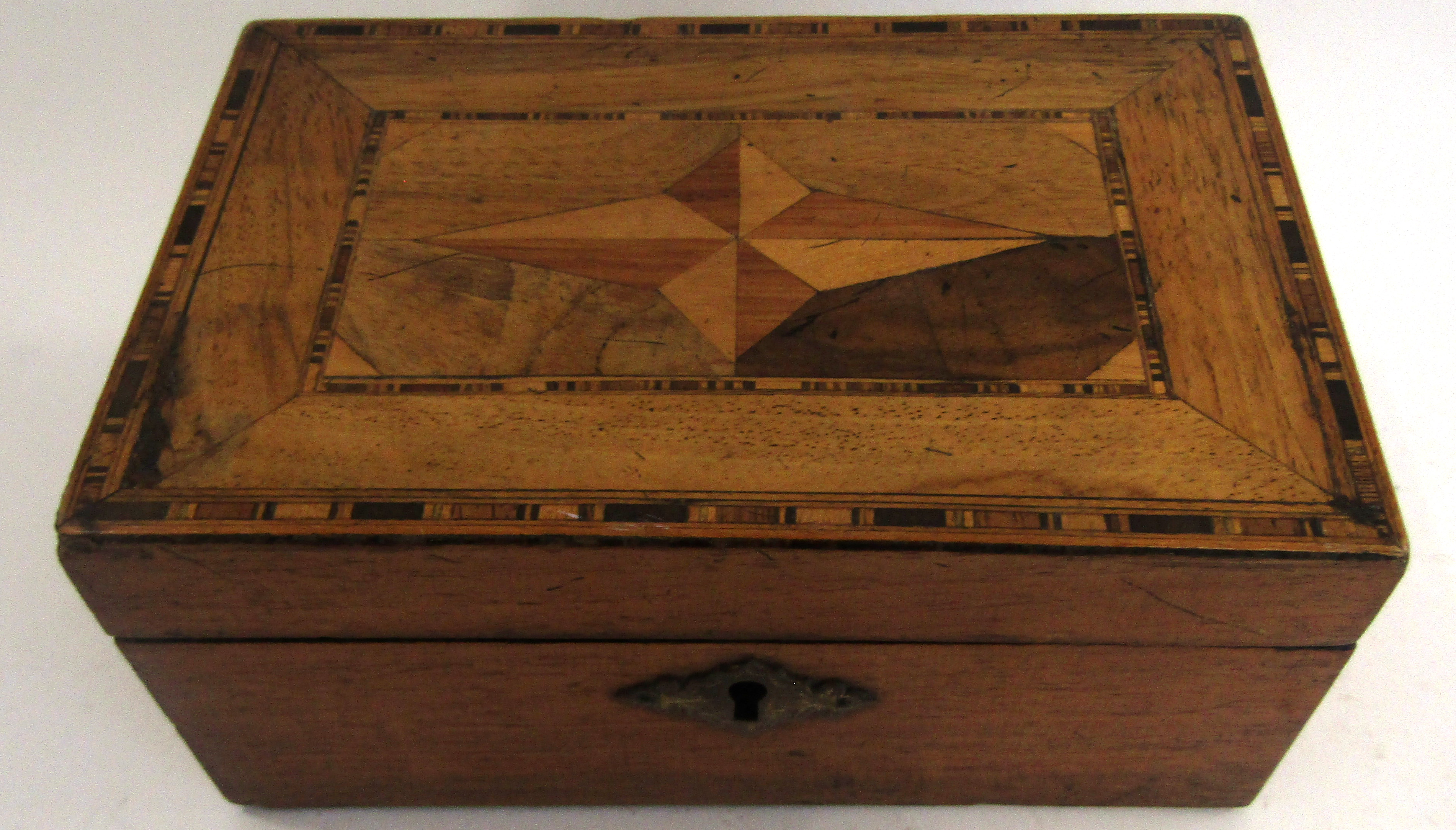 Small wooden box with marquetry inlay of a geometric design to top ...