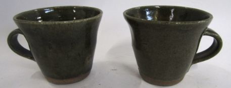 Danny Killick (b 1945) Pair of Studio Pottery cups, the ridged body with a green glazed design , 8cm