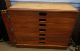 Late 20th century mahogany stained hardwood "Plan" type chest of seven drawers with locking side