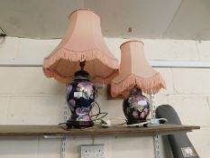 TWO SIMILAR FLORAL ELECTRIC LAMPS WITH PUCE SHADES