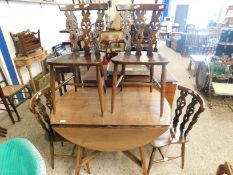 FOLDING CIRCULAR ERCOL DINING TABLE TOGETHER WITH A SET OF FOUR CHAIRS, TABLE 104CM DIAM