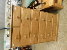 WAXED PINE FRAMED TALL TWO OVER FIVE FULL WIDTH DRAWER CHEST WITH TURNED KNOB HANDLES