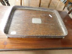 GOOD QUALITY OAK AND SILVER PLATED GALLERIED EDGE TRAY RAISED ON FOUR BALL FEET