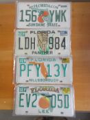 Four assorted decorative metal American Car Number Plates