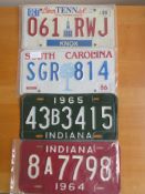 Four assorted decorative metal American Car Number Plates