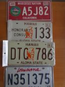 Four assorted decorative metal American Car Number Plates