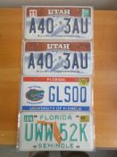 Four assorted decorative metal American Car Number Plates