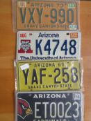 Four assorted decorative metal American Car Number Plates