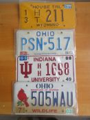 Four assorted decorative metal American Car Number Plates