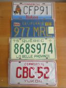 Four assorted decorative metal American Car Number Plates