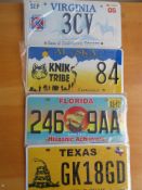 Four assorted decorative metal American Car Number Plates