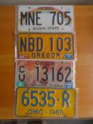 Four assorted decorative metal American Car Number Plates