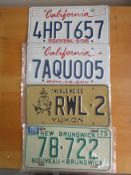 Four assorted decorative metal American Car Number Plates