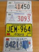 Four assorted decorative metal American Car Number Plates