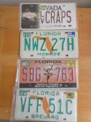 Four assorted decorative metal American Car Number Plates