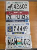 Four assorted decorative metal American Car Number Plates