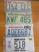 Four assorted decorative metal American Car Number Plates